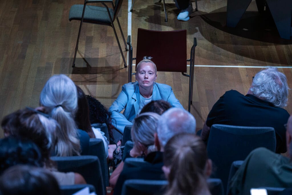 Artist Lisette Ros during her live performance intervention 'Reframing Conventions: Time-Lapse Edition' at De Balie